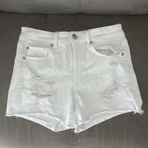 Ripped white American Eagle shorts in a size US 8 with lace detail.